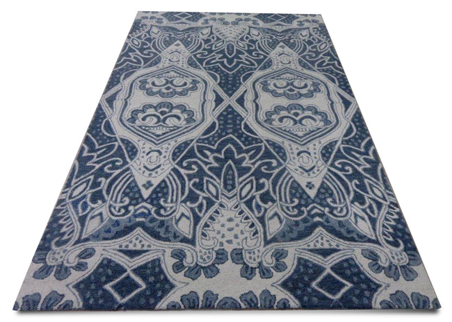 Traditional designs in monochromatic colour story makes this carpet an apt choice for a modern home. The two diamonds with traversing vines weave out a calming composition yet impart an exciting dimension to room.
