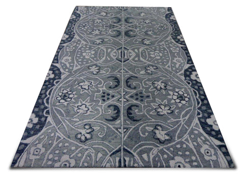 The center line divides the carpet into two mirror designs and together they complete the full carpet. The floral vine is inspired from traditional European vines but has contemporary touch to it. The colours are subdued so that the design emerges more significantly.
